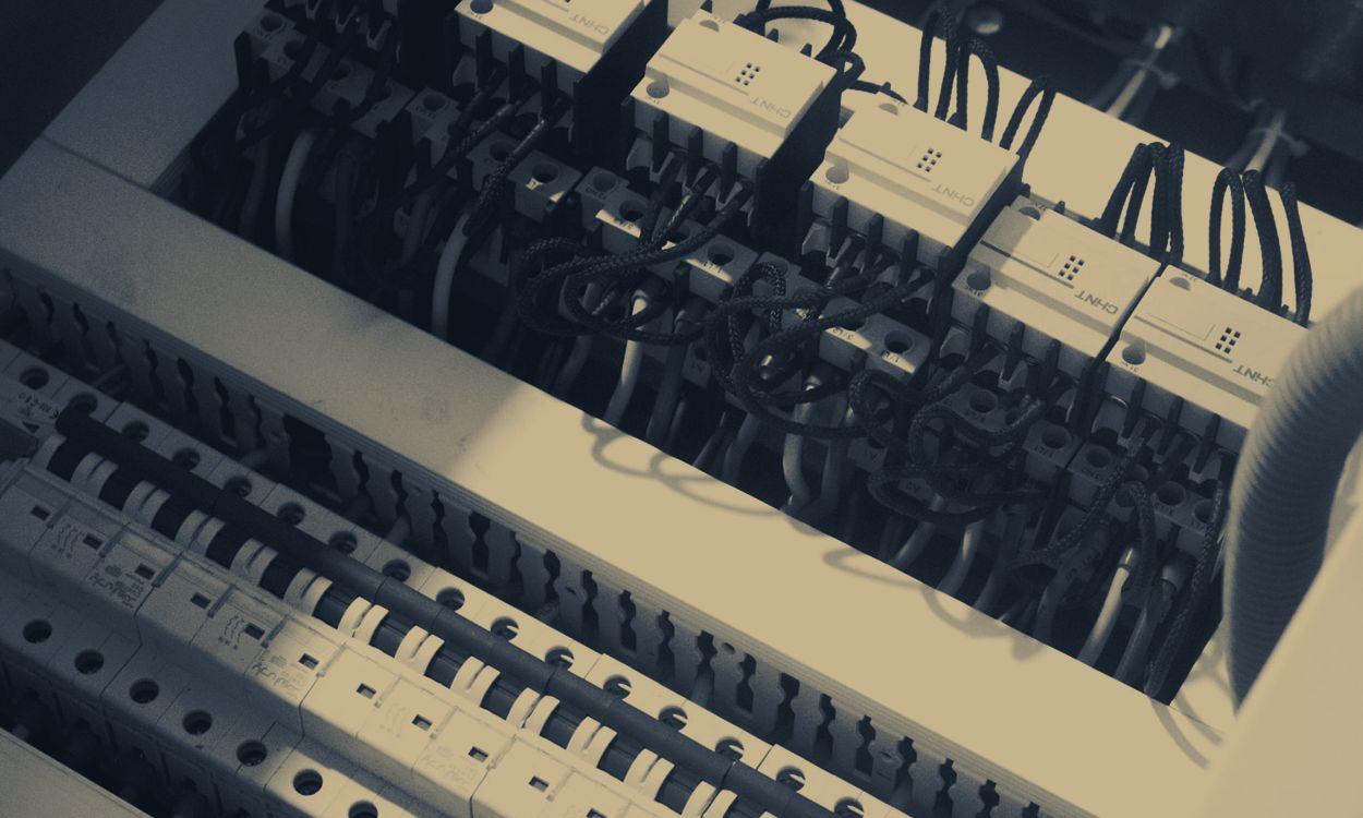 Electrician working in a breaker panel